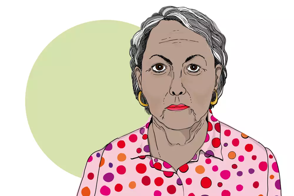 En äldre kvinna med grått hår.