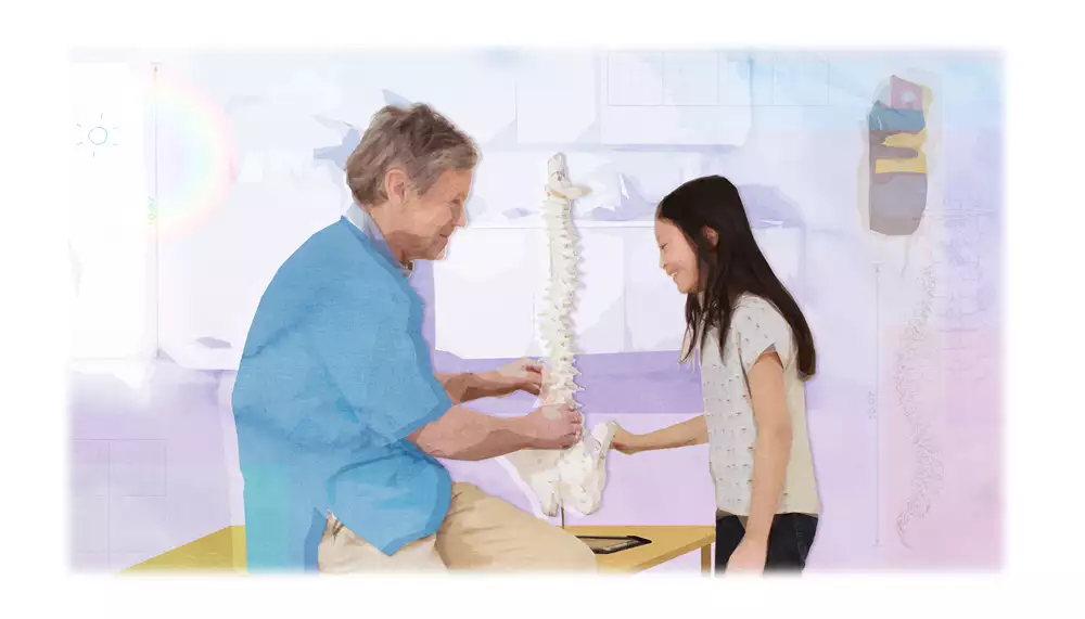 Vårdpersonal berättar och visar ett skelett för ett barn. 
